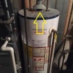 Water heater with flue pipe.