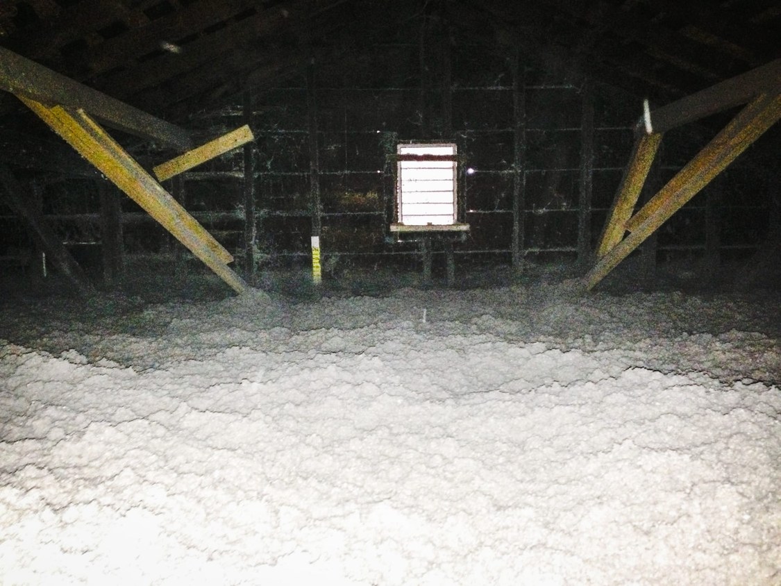 The same attic after MyGreenKC blew in deep, even insulation that covers the joists